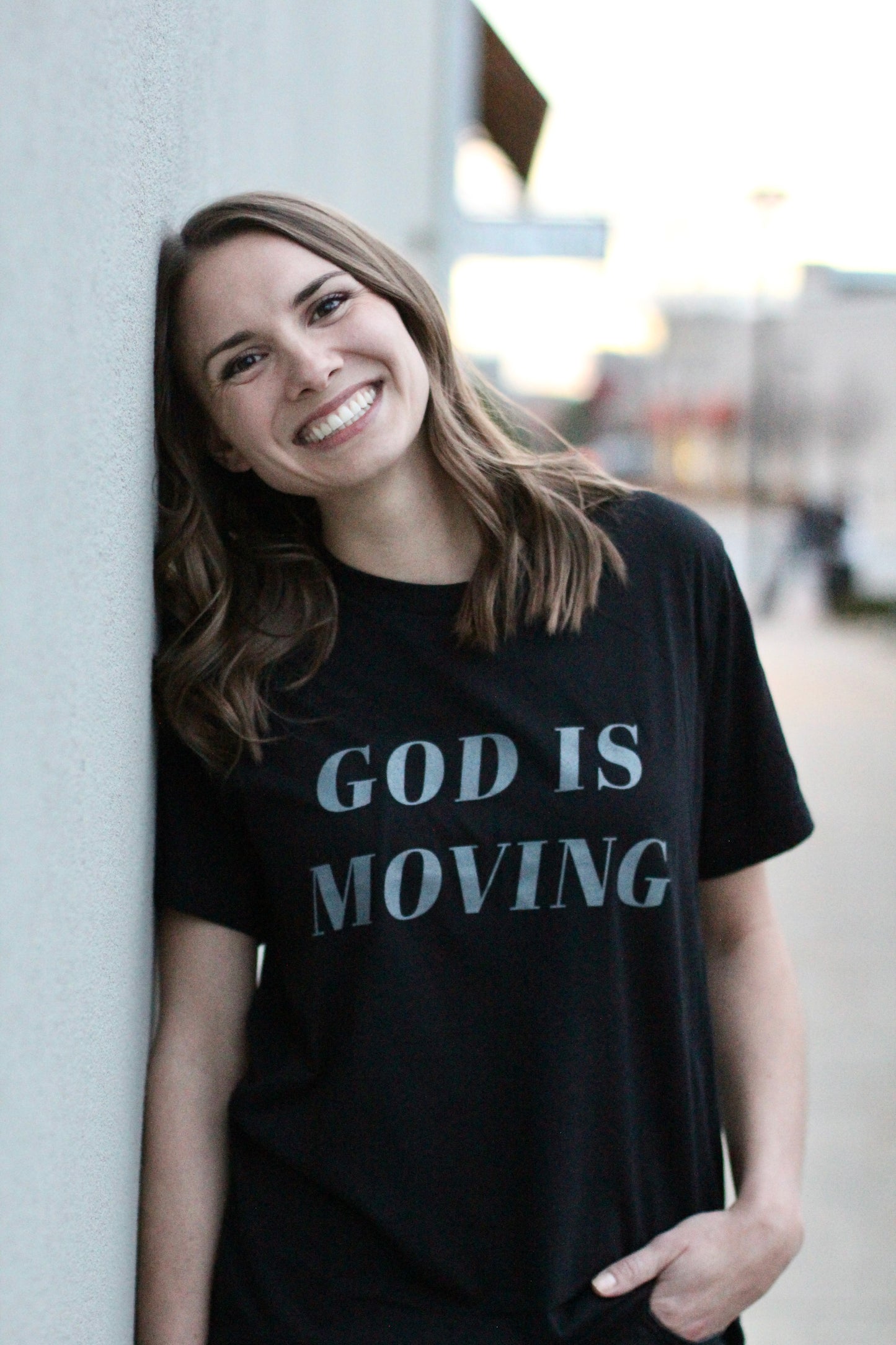 God is moving | black unisex tee