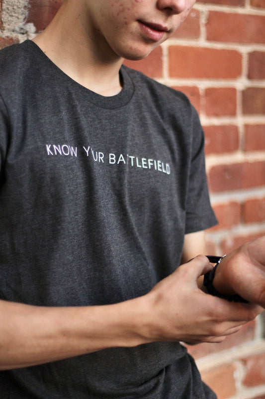 Ephesians 6:12 |  KNOW YOUR BATTLEFIELD t-shirts | Dark grey heather | Unisex